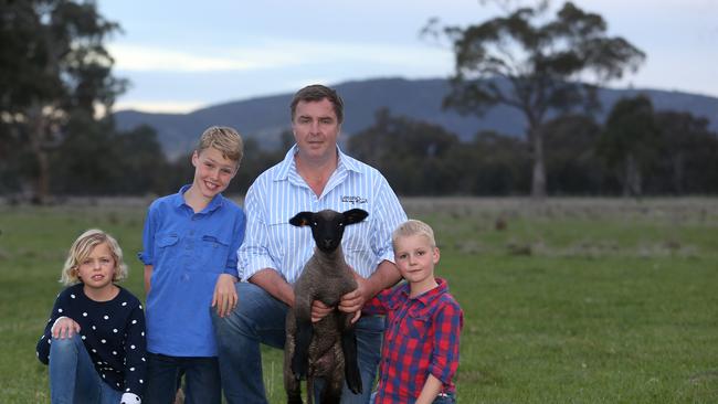 Tom Bull with his kids Hamish, Hattie, and Eddie. Picture Yuri Kouzmin