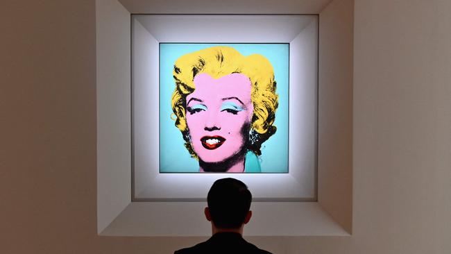 A man looks at Andy Warhol's 'Shot Sage Blue Marilyn' during Christie's 20th and 21st Century Art press preview in New York. Picture: AFP