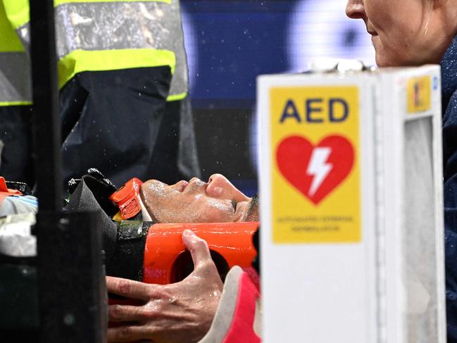 Suaalii is stretchered off after what has now been found to be a broken jaw. Picture: Saeed Khan / AFP