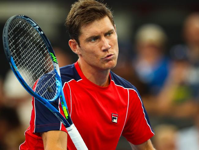 Matt Ebden of Australia hits a return against Frances Tiafoe of the US during their first round match at the Brisbane International tennis tournament at the Pat Rafter Arena in Brisbane on January 1, 2018. / AFP PHOTO / Patrick HAMILTON / --IMAGE RESTRICTED TO EDITORIAL USE - STRICTLY NO COMMERCIAL USE--