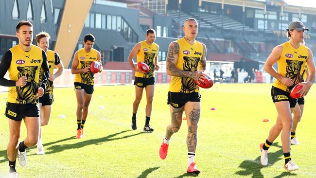 Dustin Martin leads the Tigers on a training lap at Punt Road Oval in Melbourne. Picture: Getty Images