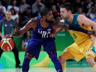 Kyrie Irving and Matthew Dellavedova in action during the Rio Olympics 2016 Men's Basketball game between the Australian Boomers and the USA Dream Team at Carioca Arena. Pics adam Head