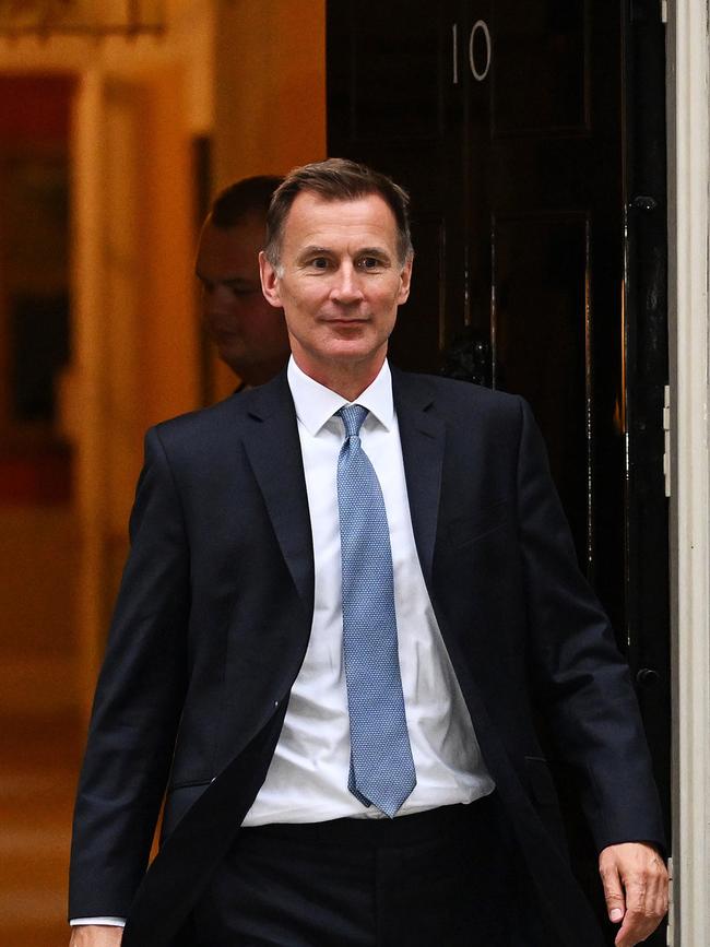 New UK Chancellor Jeremy Hunt leaves 10 Downing Street on October 14.