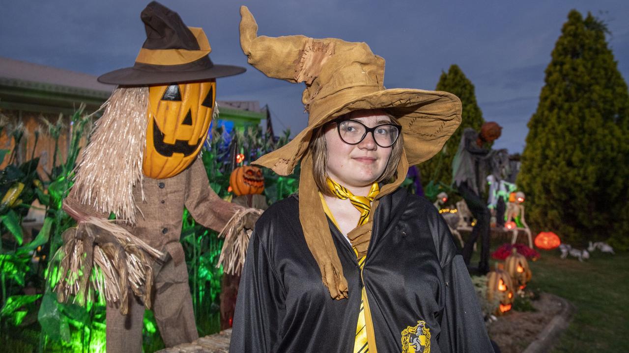 Tayla Dudley visits the Halloween display of Jo Philp. Monday, October 31, 2022. Picture: Nev Madsen.