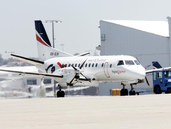 A REX plane is towed to a hangar at Sydney Airport in Sydney after a REX flight had a problem before landing safely.