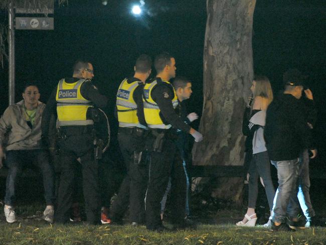 Bystanders outside a party which was gatecrashed. Picture: Andrew Henshaw