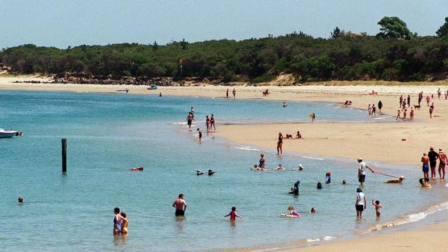 People relaxing at the beach at Inverloch.