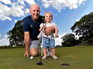 WINNER: Adam Norlander from the Headland Golf Club has been awarded the Australian PGA Club Pro of the year. Adam is with his daughter Ellie, 17 months, on the practice green. Picture: Warren Lynam