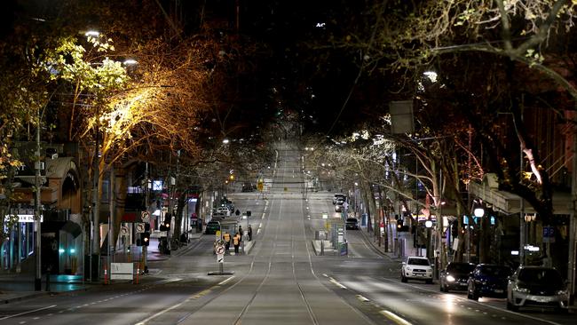 An empty Collins Street after 8pm on Sunday. Picture: Getty Images.