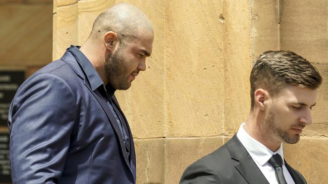 Semir Jasic, left, and Luke Nicolas Lorraine, right, outside the Adelaide Magistrates Court. Picture: AAP.