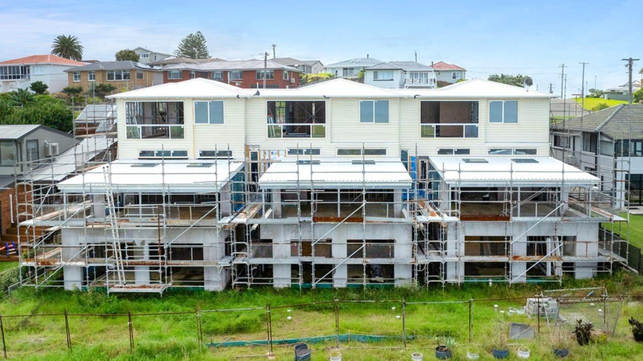 This row of three unfinished waterfront townhouses in Kiama recently sold for $4.75m.