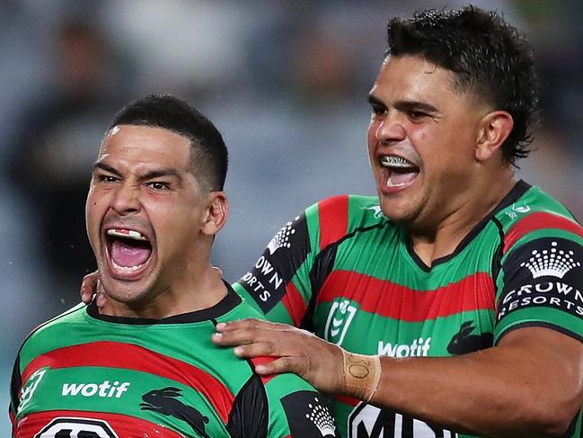 SYDNEY, AUSTRALIA - MARCH 25: Cody Walker of the Rabbitohs celebrates with Latrell Mitchell and Keaon Koloamatangi of the Rabbitohs after scoring a try during the round three NRL match between the South Sydney Rabbitohs and the Sydney Roosters at Accor Stadium, on March 25, 2022, in Sydney, Australia. (Photo by Matt King/Getty Images)