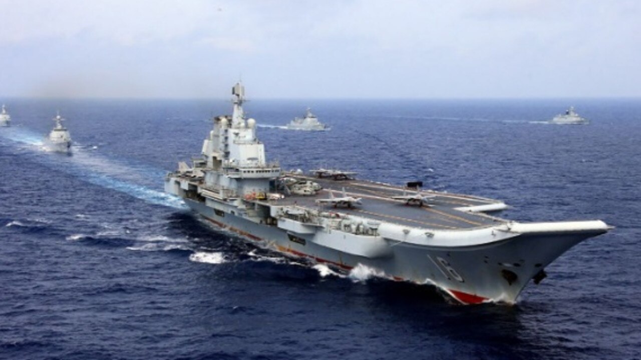 China’s first aircraft carrier, Liaoning, and its battle group. A second carrier is about to enter service, and a third is under construction. Picture: PLA