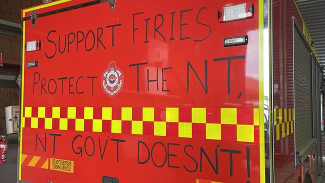 NT Firefighters have been writing slogans on their firetrucks as part of a protected industrial action during ongoing EBA negotiations. Picture: Supplied.