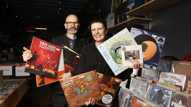 Adam MacGregor with wife Kirsty MacGregor with a selection of records to be released on the day.  Tommy Gun Records in Hobart ahead of National Record Store Day.  Picture: Nikki Davis-Jones