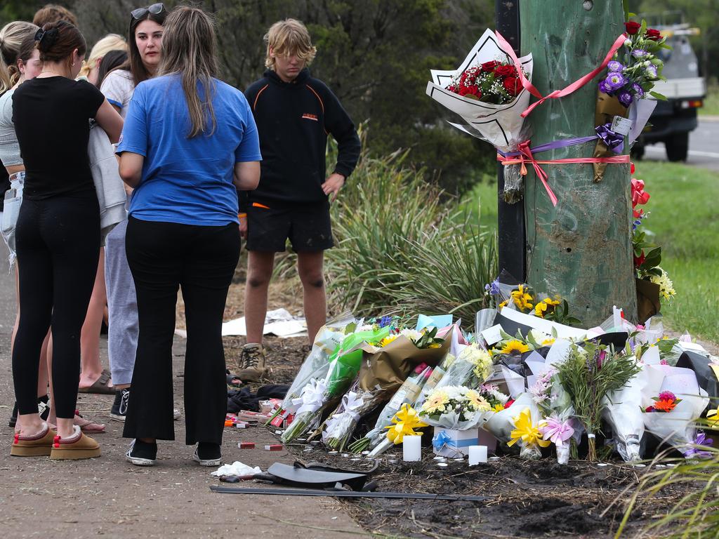 Mourners at the site of the crash on Tuesday afternoon. Picture: NCA NewsWire