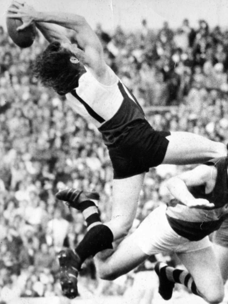 Russell Ebert flies to take a mark against Glenelg in 1974 preliminary final at Football Park.