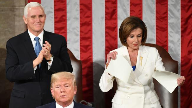 Speaker of the US House of Representatives Nancy Pelosi rips up a copy of US President Donald Trumps speech. Picture: AFP