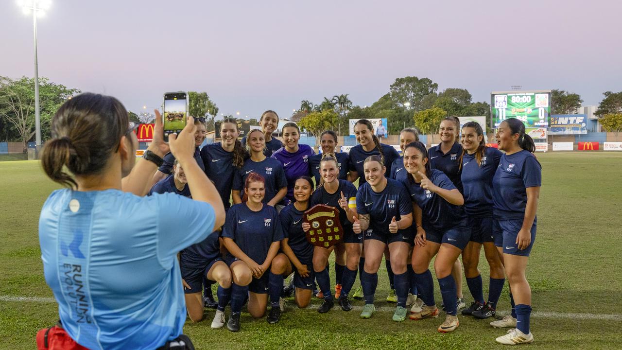 Royal Australian Navy women's soccer team with the game trophy after winning a 4th of July soccer match. Picture: Supplied.