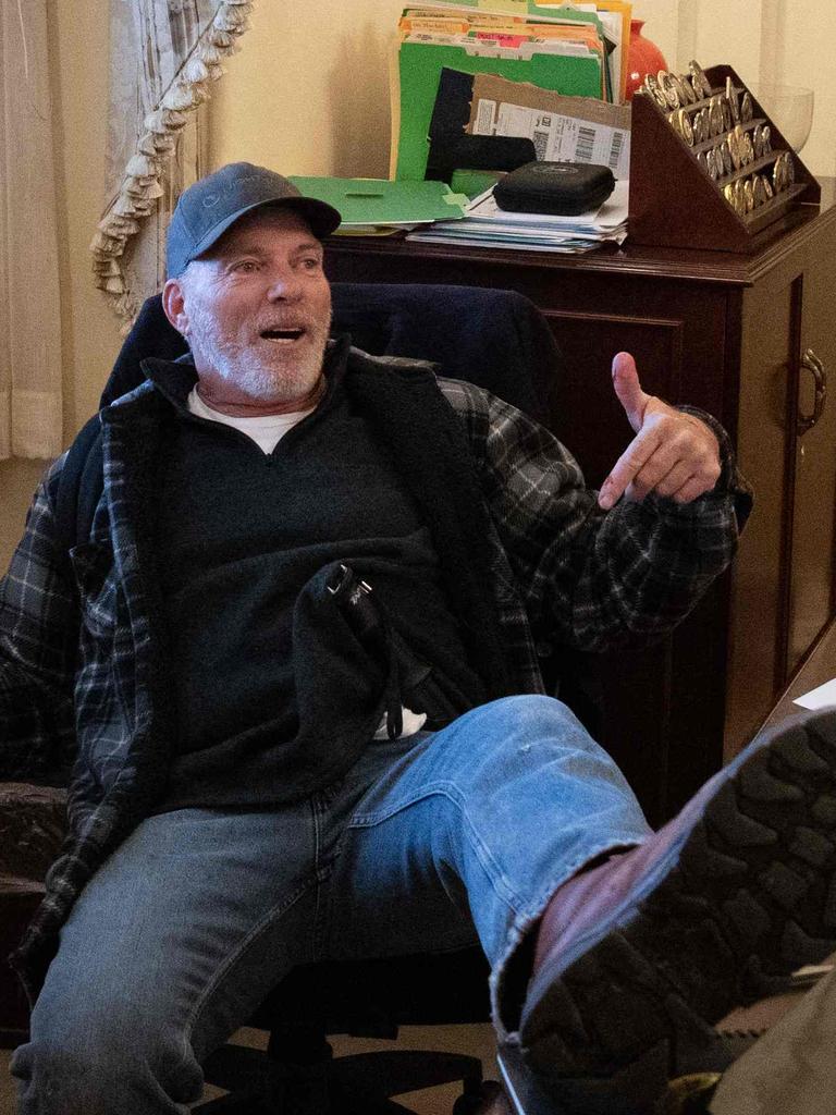 Donald Trump supporter Richard Barnett sits at the desk of then US Speaker of the House Nancy Pelosi. Picture: Saul Loeb/AFP