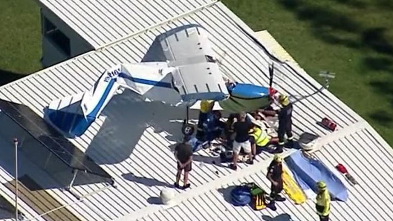 A pilot in his 70s has been taken to hospital after his light plane crashed, landing on the roof of a hangar at an aerodrome in southwestern Sydney. Picture: Sky News