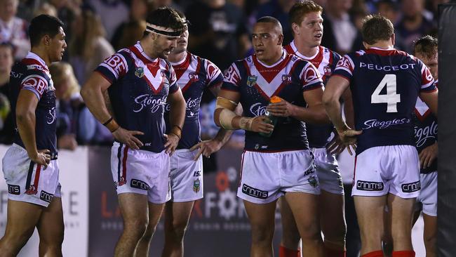 A group of dejected Roosters after losing to the Sharks in NRL round 13. Picture: Mark Kolbe/Getty Images.