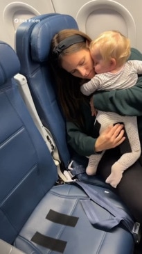 Mum's velcro solution for keeping baby secure on plane