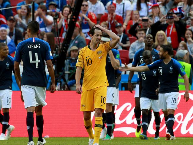 Australia’s opening-game loss was a bitter pill to swallow for Robbie Kruse (C), but still better than where he’s been in recent years. Picture: Toby Zerna