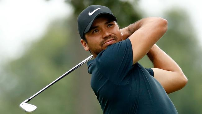 Jason Day hits off the 15th tee.