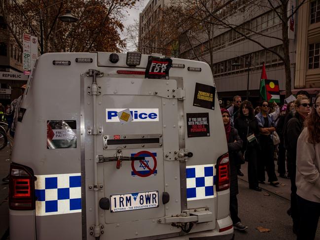 Protesters placed anti-Israel stickers on the back of a police car. Picture: Tamati Smith