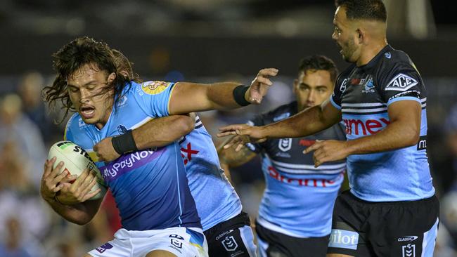 SYDNEY, AUSTRALIA - AUGUST 11: Tino Fa'asuamaleaui of the Titans is tackled during the round 24 NRL match between Cronulla Sharks and Gold Coast Titans at PointsBet Stadium on August 11, 2023 in Sydney, Australia. (Photo by Brett Hemmings/Getty Images)