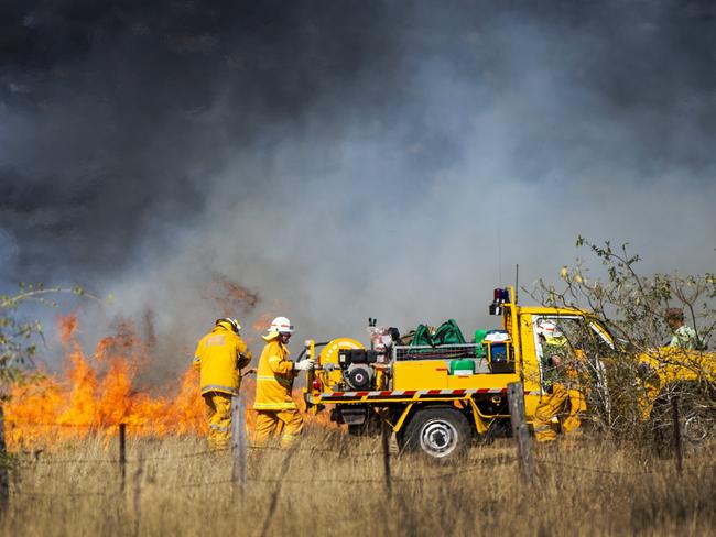 Crews battle fires in the Gold Coast hinterland yesterday. Picture: Nigel Hallett