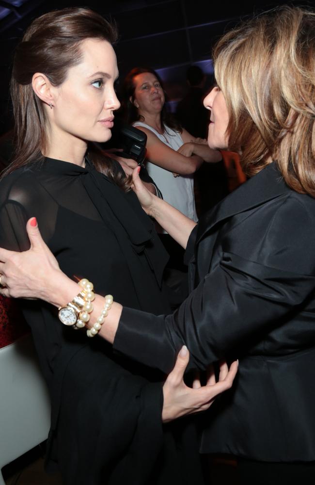 Not happy, Jan ... Angelina Jolie greets Amy Pascalafter the email in which Pascal called jolie a “spoiled brat” was made public. Picture: Alex J. Berliner / ABImages via AP