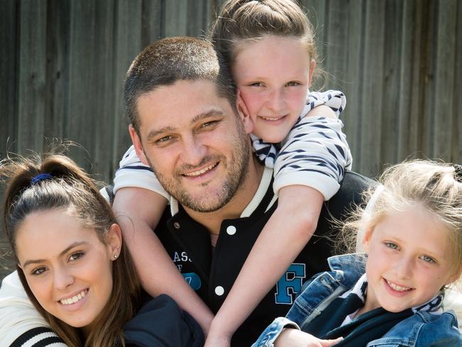 Brendan Fevola with his girls, Mia (17), Lulu (7) and Leni (10). Picture: Jay Town