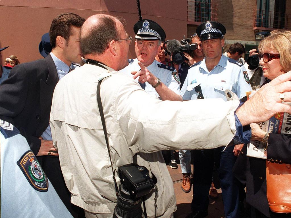 Royal photographer Arthur Edwards argues with Sydney police over photo restrictions during Princess Diana's Australian charity in 1996. Picture: NSW Police