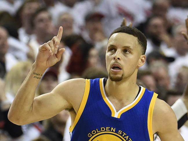 PORTLAND, OR - MAY 9: Stephen Curry #30 of the Golden State Warriors celebrates after hitting a shot during overtime of Game Four of the Western Conference Semifinals against the Portland Trail Blazers during the 2016 NBA Playoffs at the Moda Center on May 9, 2016 in Portland, Oregon. The Warriors won 132-125. NOTE TO USER: User expressly acknowledges and agrees that by downloading and/or using this photograph, user is consenting to the terms and conditions of the Getty Images License Agreement. Steve Dykes/Getty Images/AFP == FOR NEWSPAPERS, INTERNET, TELCOS & TELEVISION USE ONLY ==