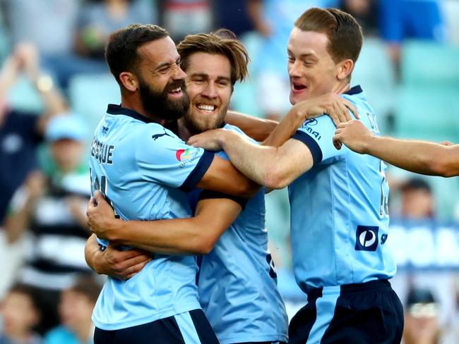 Sydney's Alex Brosque is swamped by teammates after scoring a goal at Allianz Stadium. Picture: Gregg Porteous