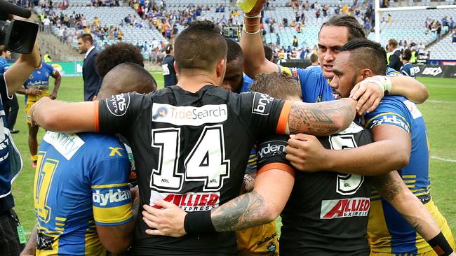 Players from both Tigers and Eels teams pray after the Round four match. Picture: Gregg Porteous