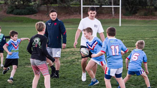 Radley and Lam play touch with Clovelly Crocodiles juniors. Picture: James Gourley