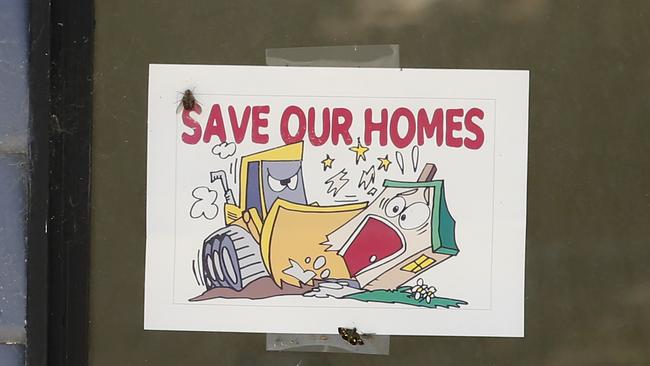 A protest poster on a condemned home at Wantirna Caravan Park. Picture: David Caird