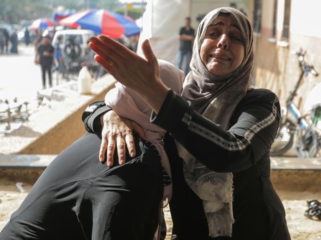 Palestinians react as civilians, injured in Israeli raids, arrive at Nasser Medical Hospital in Khan Yunis, Gaza. Picture: Getty Images