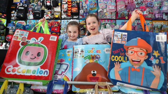 Sisters Olivia Peers 4 and Harriet Peers 6 of Nerang with some of the showbags that will be on offer at this year’s Gold Coast Show, with something to suit all ages. Picture Glenn Hampson