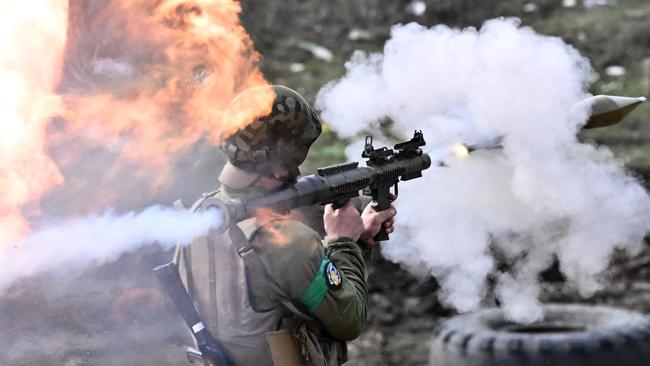 A Ukrainian serviceman fires a rocket-propelled grenade (RPG) from a launcher during a training exercise in the Donetsk region. Picture: AFP.