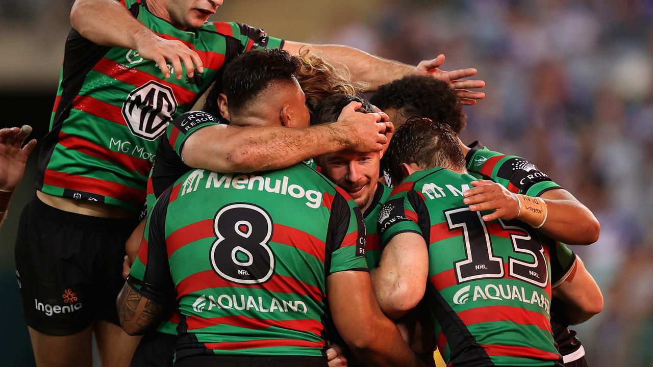 SYDNEY, AUSTRALIA - APRIL 15: Damien Cook of the Rabbitohs celebrates scoring a try during the round six NRL match between the South Sydney Rabbitohs and the Canterbury Bulldogs at Stadium Australia, on April 15, 2022, in Sydney, Australia. (Photo by Cameron Spencer/Getty Images)