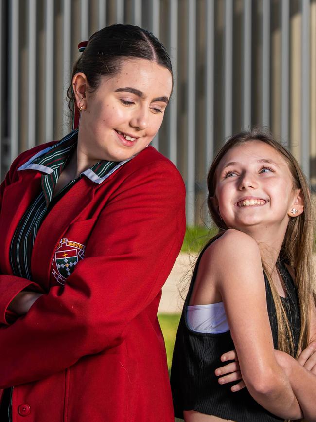 Eva Mellor, 13, is going into year 8 at Kildaire College, she is pictured on the Holden Hill campus with her little Lilli, 10, who will be attending the school in 2024. Picture: Naomi Jellicoe