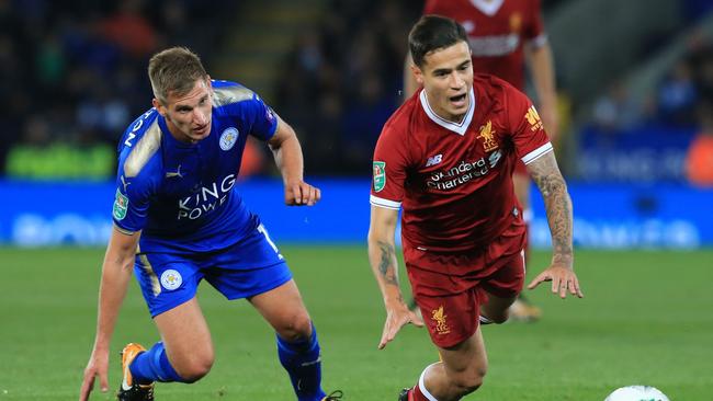 Liverpool's Brazilian midfielder Philippe Coutinho (R) vies with Leicester City's English midfielder Marc Albrighton (L).