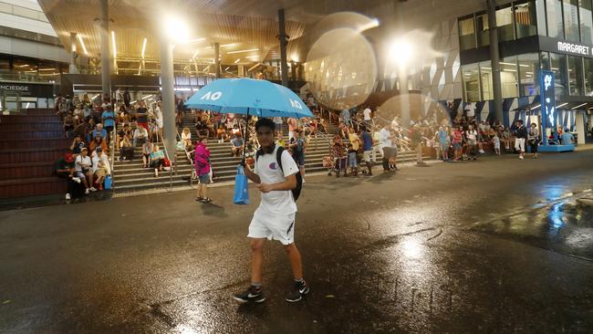 Heavy rain falls at Melbourne Park last night. Picture: Getty Images