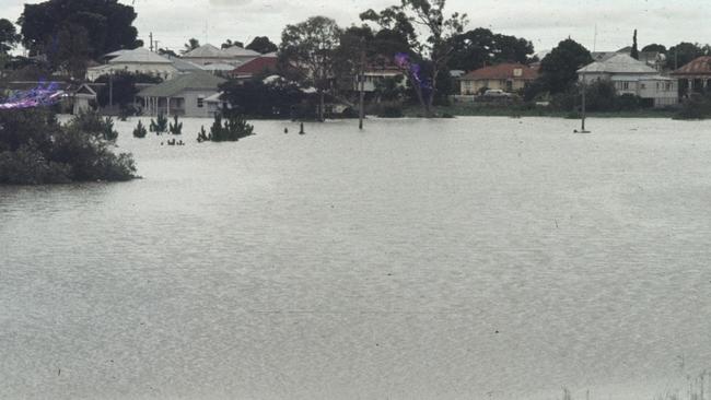 Walla Street in flood, 1971. Floodwaters transform a familiar street into a waterway. Source: QLD Places