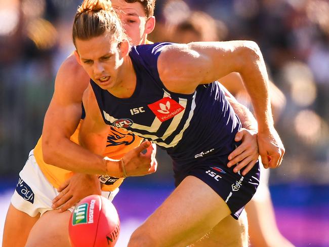 PERTH, AUSTRALIA - APRIL 29: Nat Fyfe of the Dockers competes for the ball against Jack Redden of the Eagles during the 2018 AFL round six match between the Fremantle Dockers and the West Coast Eagles at Optus Stadium on April 29, 2018 in Perth, Australia. (Photo by Daniel Carson/AFL Media/Getty Images)