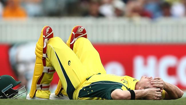 Steve Smith lies on the floor after being hit in the crotch by a Colin de Grandhomme delivery.